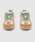 Pair of brown and white fuzzy sneakers with green laces on a white background