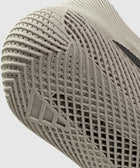 Close-up of beige sneaker sole with textured, breathable, and perforated details