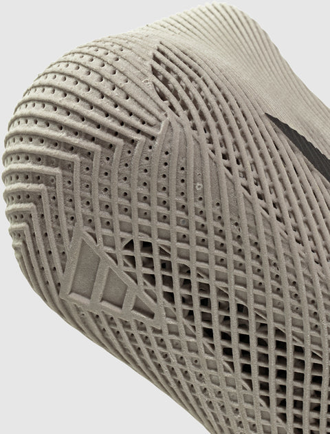 Close-up of beige sneaker sole with textured, breathable, and perforated details