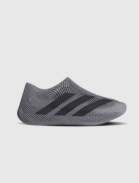 Grey mesh slip-on sneaker with black stripes, minimalist streetwear shoe design
