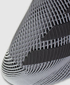 Close-up of a grey sneaker toe with textured mesh and black stripe accents