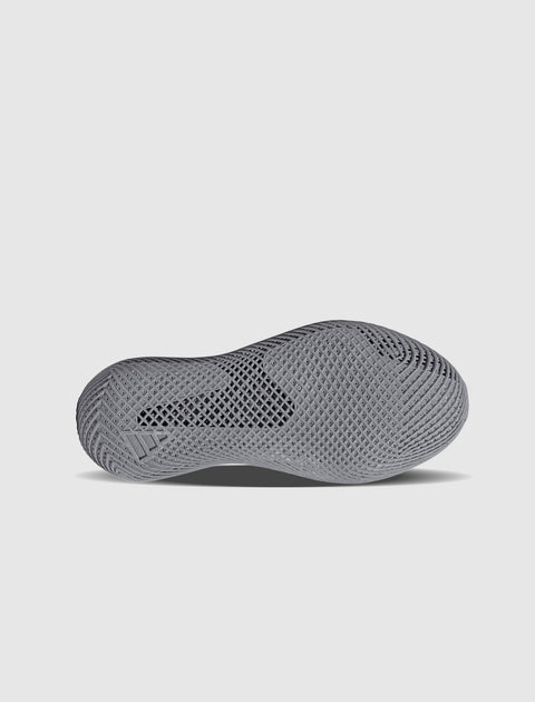 Gray sneaker outsole with textured, ventilated pattern on white background