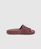 Maroon sculpted slide sandal with textured upper and rugged sole on white background