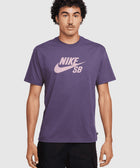 Man wearing a purple Nike SB t-shirt with pink logo, streetwear fashion