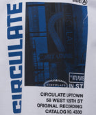 White streetwear t-shirt with blue graphic print, jazz lounge and bold 'CIRCULATE' text
