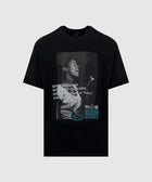 Black streetwear t-shirt featuring a vintage photo print of a woman singing into a microphone