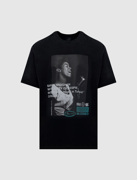 Black streetwear t-shirt featuring a vintage photo print of a woman singing into a microphone