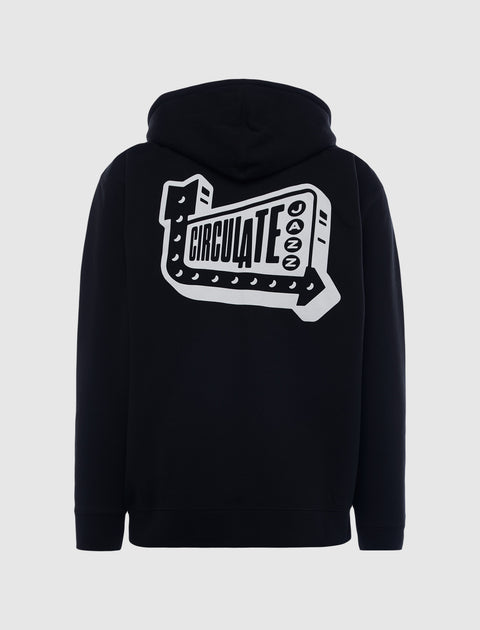 Black streetwear hoodie with bold white 'Circulate Jazz' graphic on back
