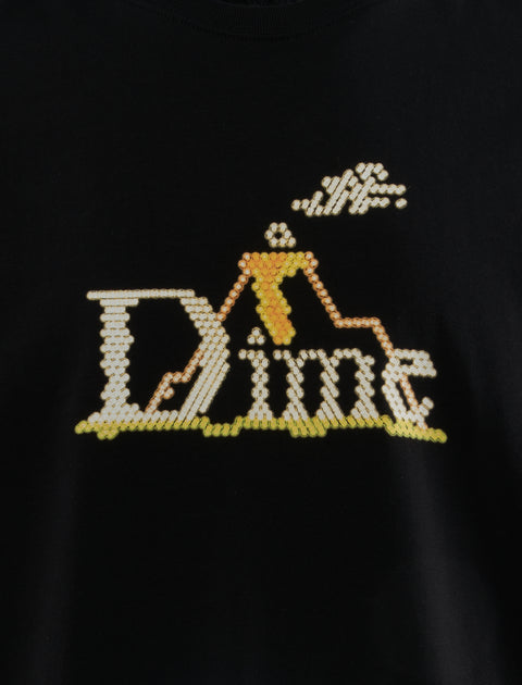 Black streetwear shirt with yellow cross-stitched graphic and Dime text detail