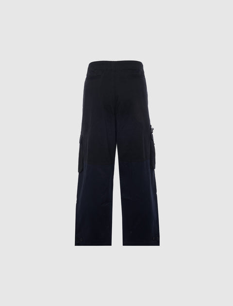 Back view of black men's streetwear cargo pants with flap pockets and wide leg fit