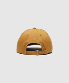 Tan streetwear dad hat with embroidered Dime logo and adjustable strapback closure