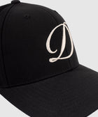 Black streetwear baseball hat with large white embroidered D logo on front