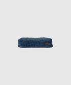 Denim blue quilted streetwear cap with orange stitched grid pattern and subtle logo