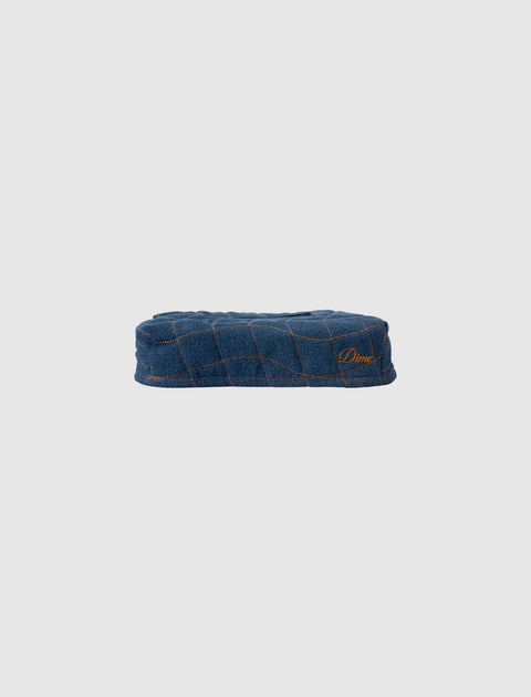 Denim blue quilted streetwear cap with orange stitched grid pattern and subtle logo