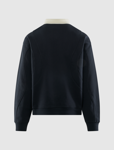 Back view of navy men's streetwear pullover with contrast collar and panel details