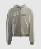 Two-tone grey zip-up hoodie with embroidered 'Di me' text on the front, streetwear style.