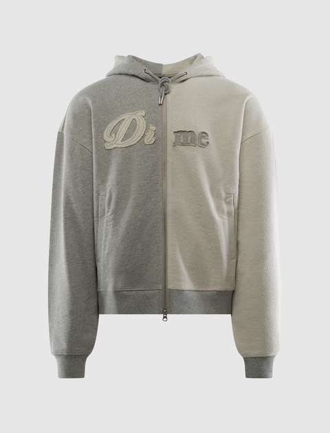 Two-tone grey zip-up hoodie with embroidered 'Di me' text on the front, streetwear style.