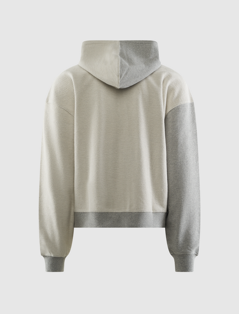 Back view of colorblock men's streetwear hoodie in beige and grey with ribbed cuffs and hem