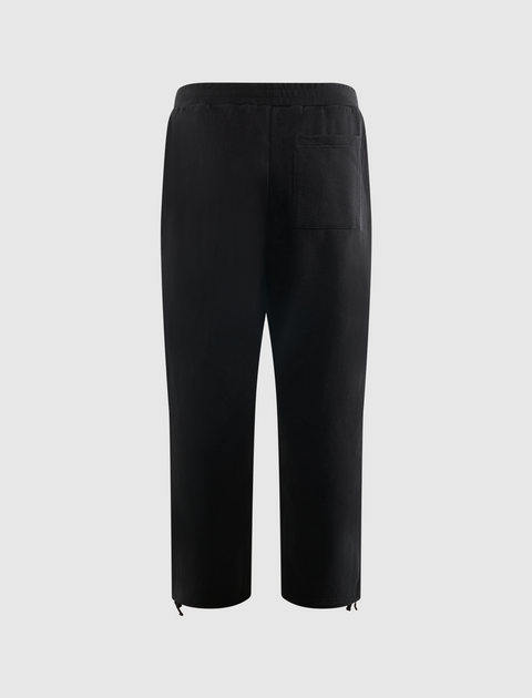 Back view of black men's streetwear pants with elastic waistband, single rear pocket, and drawstring hems.