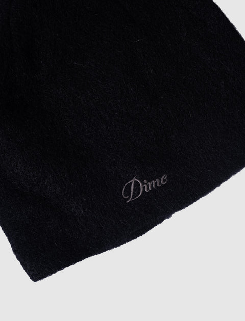 Black fuzzy beanie hat with embroidered 'Dime' logo detail on light background