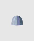 Blue gradient knit beanie hat with subtle embroidered detail on plain background