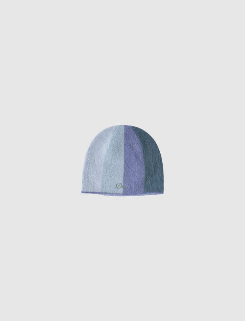Blue gradient knit beanie hat with subtle embroidered detail on plain background