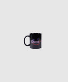 Black ceramic mug with purple and red smiley face graphic on front