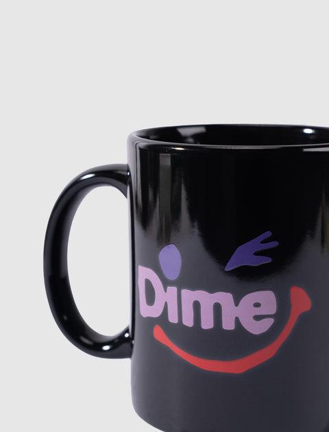 Black ceramic mug with Dime logo and colorful winking smiley face graphic