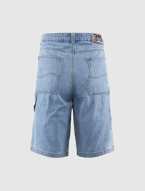 Back view of blue denim men's shorts with large pockets and black patch detail