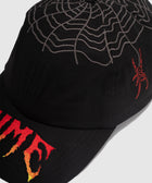 Black streetwear cap with embroidered spiderweb, red spider, and flame text detail