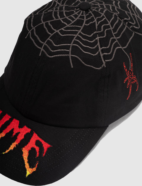 Black streetwear cap with embroidered spiderweb, red spider, and flame text detail