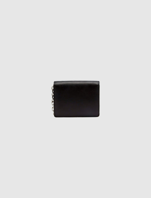 Black leather wallet with chain detail on light gray background