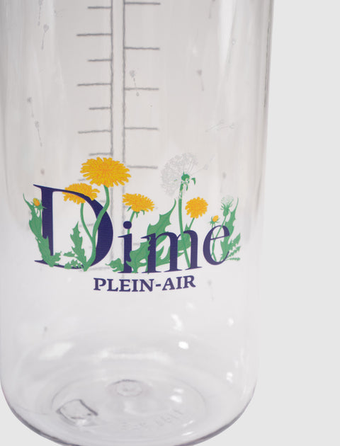 Clear water bottle with measuring marks, floral dandelion design, and 'Dime PLEIN-AIR' text.