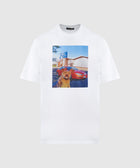 White streetwear t-shirt with cat, red car, and building graphic on front