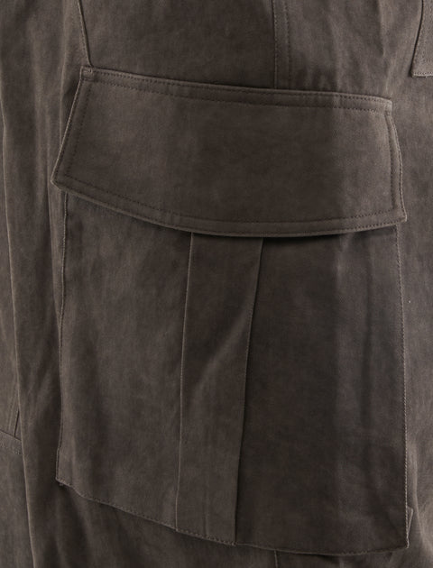 Close-up of taupe cargo pocket detail on men's streetwear pants