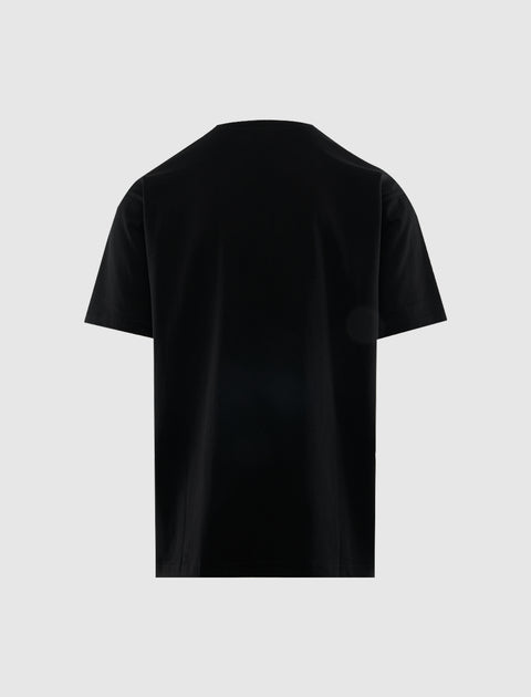 Back view of plain black men's streetwear t-shirt on light background