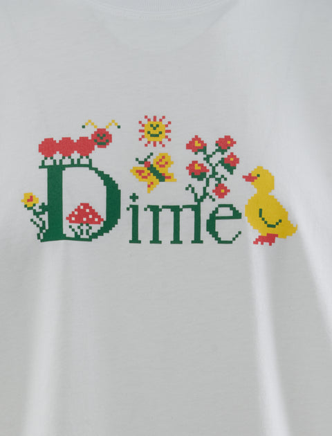 White t-shirt with pixel art Dime logo, caterpillar, duck, sun, flowers, and butterfly