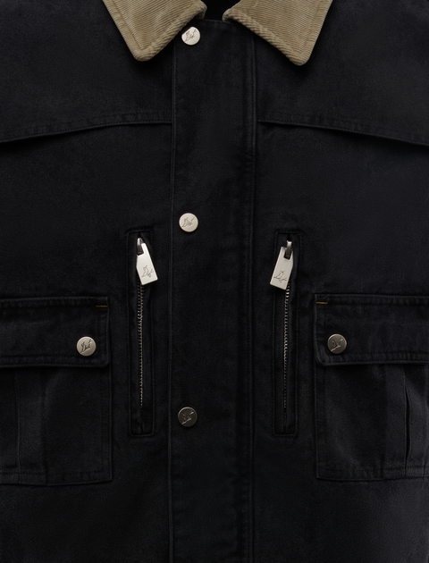 Black streetwear jacket with beige corduroy collar, front snap buttons, chest pockets, and zippers