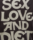 Cracked white text graphic on dark streetwear top with bold slogan design