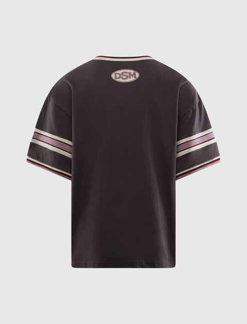 Black streetwear t-shirt with DSM patch, striped sleeves, and contrast trim, back view