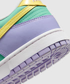 Pastel low-top sneaker with yellow, mint green, and lavender panels and white sole