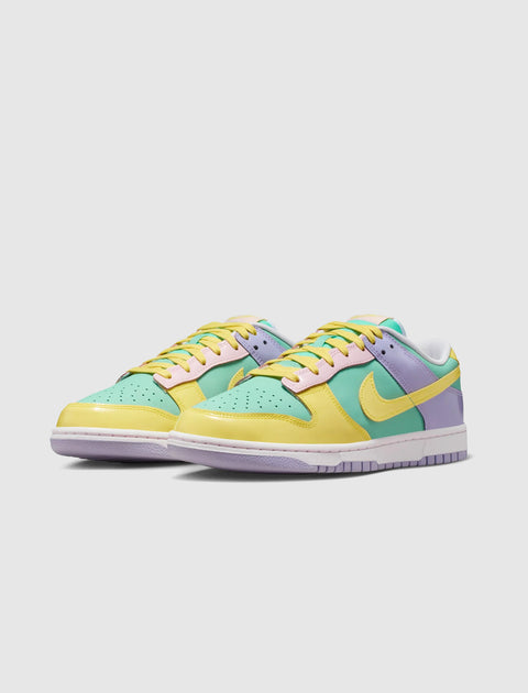 Pastel multicolor low-top sneakers with yellow, green, and purple accents on a white sole