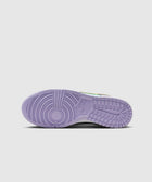 Purple outsole of a sneaker with circular tread, detailed view on white background