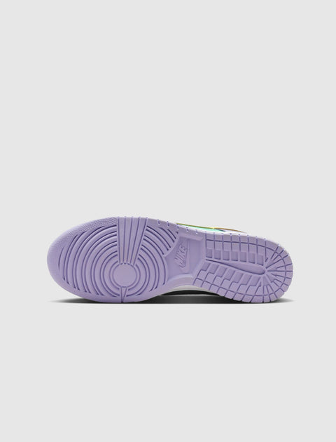 Purple outsole of a sneaker with circular tread, detailed view on white background