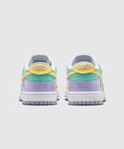 Back view of pastel Nike low-top sneakers with yellow, mint green, and lavender panels