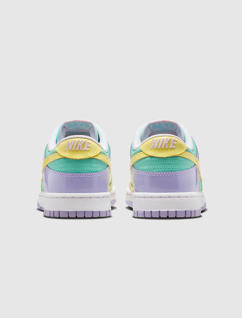 Back view of pastel Nike low-top sneakers with yellow, mint green, and lavender panels