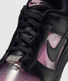 Close-up of black and pink Nike sneaker with textured leather and translucent panels