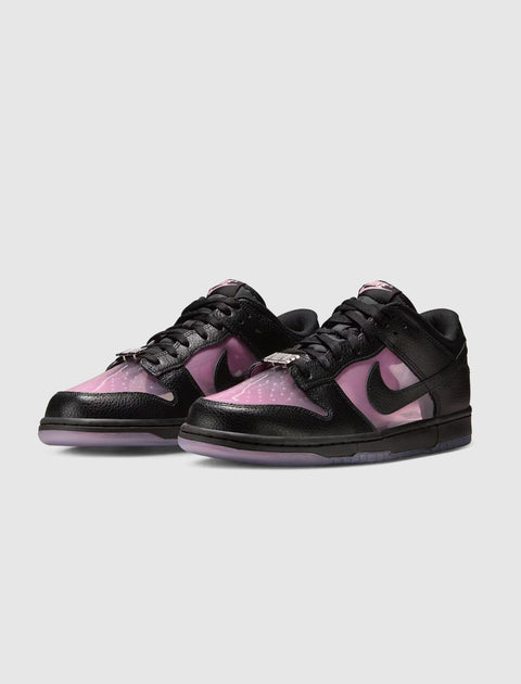 Pink and black low-top sneakers with translucent panels and black laces on a white background.