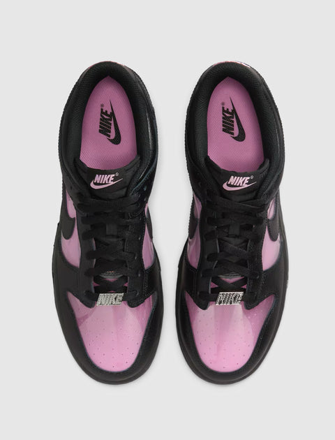 Top view of black and pink low-top Nike sneakers with perforated toe box