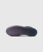 Translucent purple and blue rubber sneaker sole with traction pattern on white background